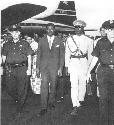 Prime Minister Patrice Lumumba (second from left)...